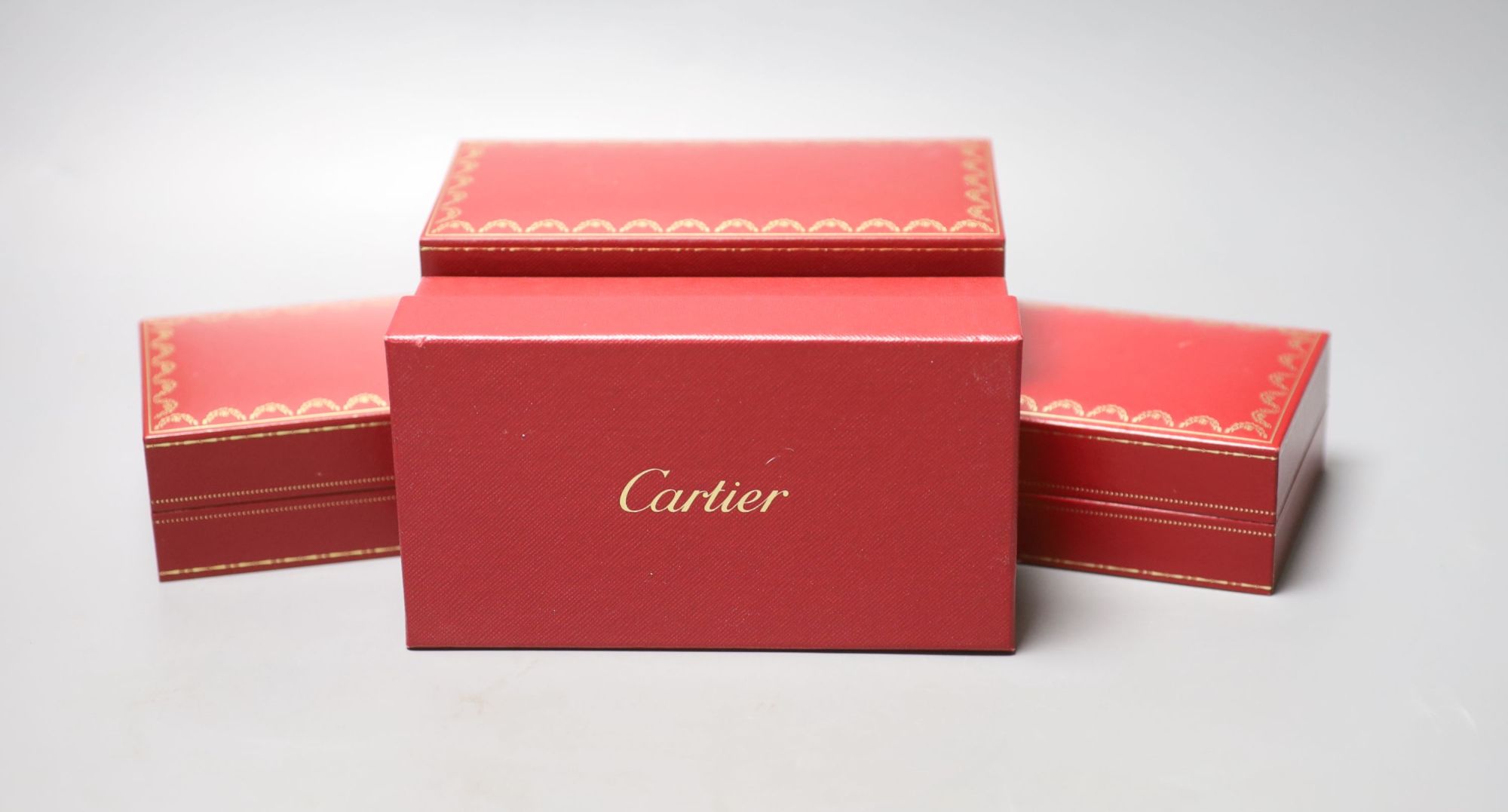 Three modern Cartier fitted jewellery boxes and one other Cartier box.